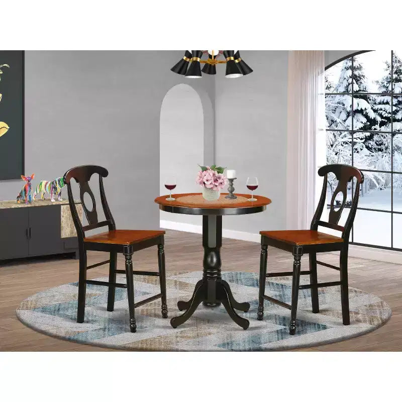 Tavolo da pranzo rotondo HomeStock da 3 pezzi con finitura nera, piano in legno massello e 2 sedie